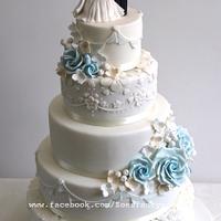 Wedding cake with blue rose details