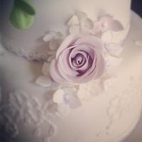 Lavender and lilac rose bloom wedding cake