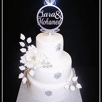white and silver wedding cake 