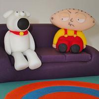 Family guy style cake, stewie and brian on the sofa