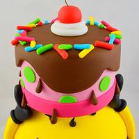 Minion balancing a birthday cake on his head!
