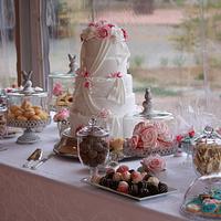 Wedding cake with dessert table