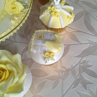 lemon, white and gold birdcage and matching cupcakes