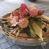Spray of hosta leaves, rose, carnations and jasmine