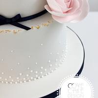 Gilding and pearls wedding cake