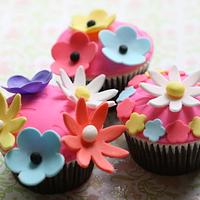 chocolate cupcakes embellished with gum paste flowers