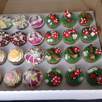 garden theme cake with cupcakes