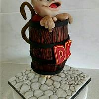 Gravity defying Diddy Kong stuck in a DK barrel cake.