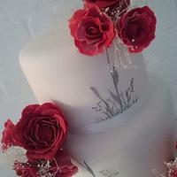 Red and white handpainted wedding cake