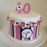 Pink, black and white birthday cake