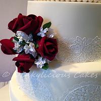 Ivory and burgundy wedding cake