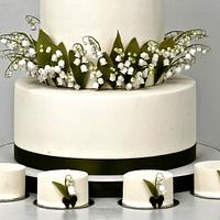 Spring wedding cake with lilies of valley