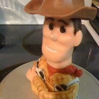 Toy Story birthday featuring "Woody" ripping through top tier