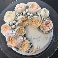 Crescent style buttercream flowers cake