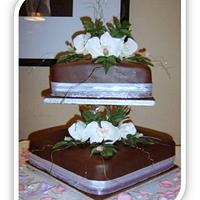 White Cymbidium Orchids on Belgium Chocolate wedding cakes