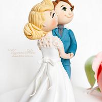 wedding cake with bride and groom
