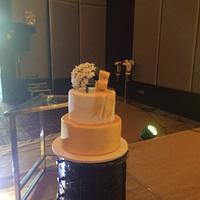 Wedding cake with a bouquet of jasmine flower