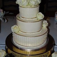 Buttercream gold and dots wedding cake