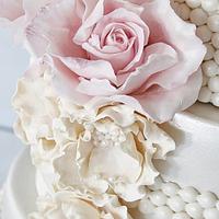 Wedding cake in pearl and pink.