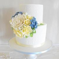 Blue and yellow wedding cake