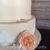 Ivory and peach rose wedding cake 