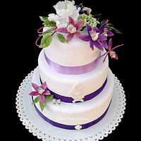 wedding cake with purple orchid